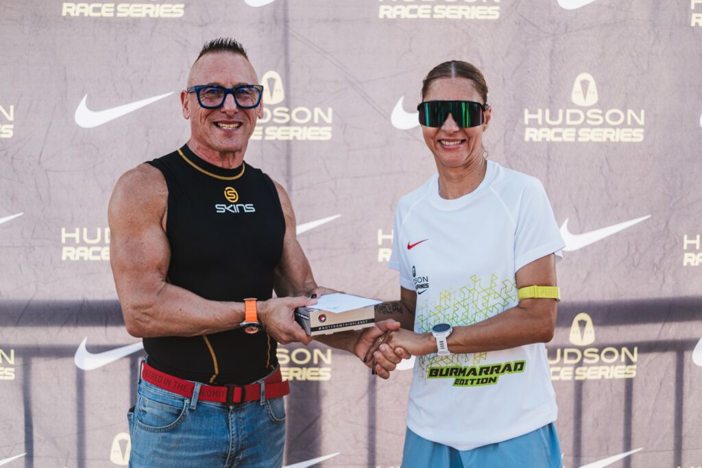 A runner receiving her prize at the Hudson Race Series Burmarrad edition